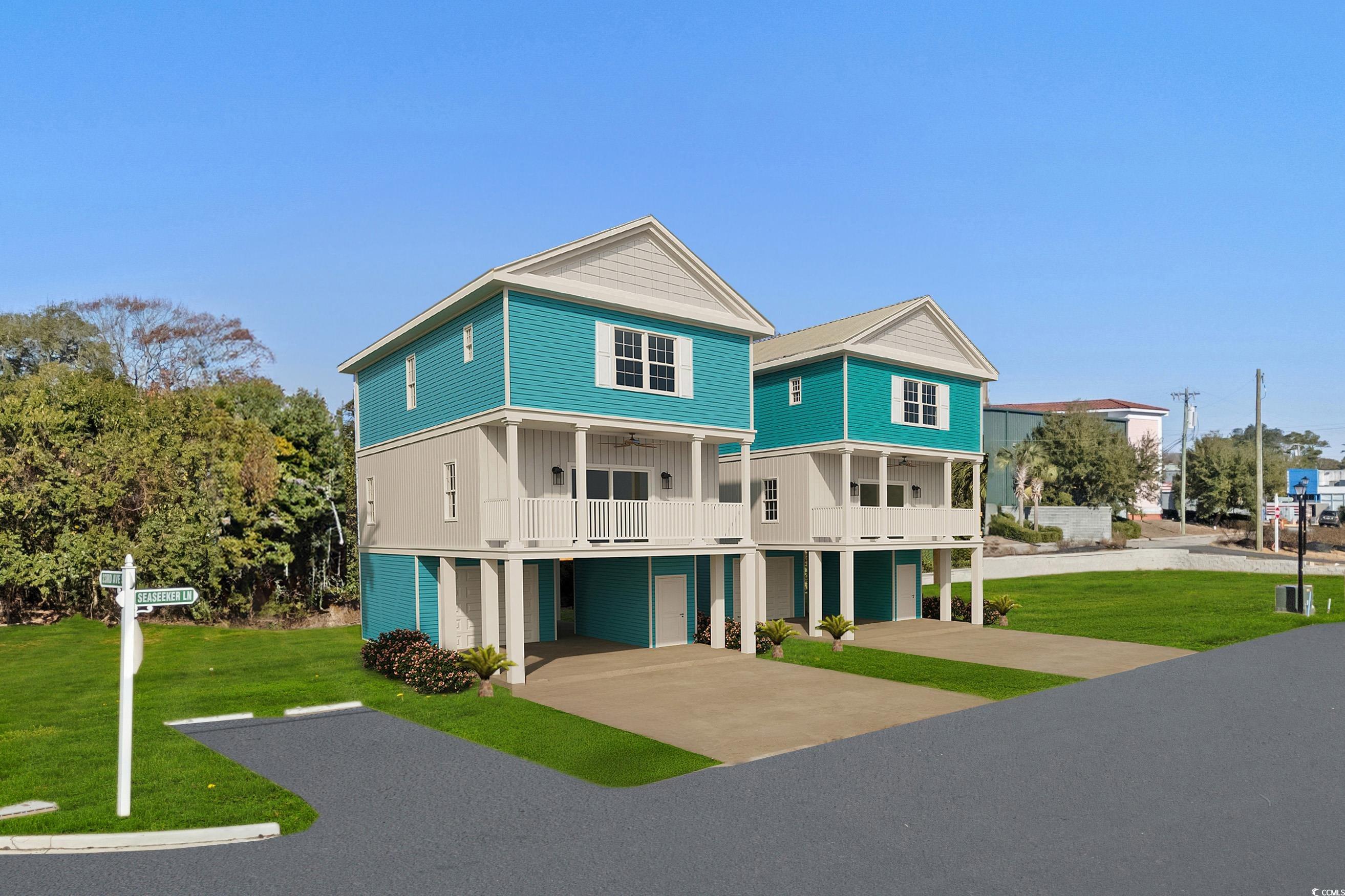 View of front of property featuring a carport, a g