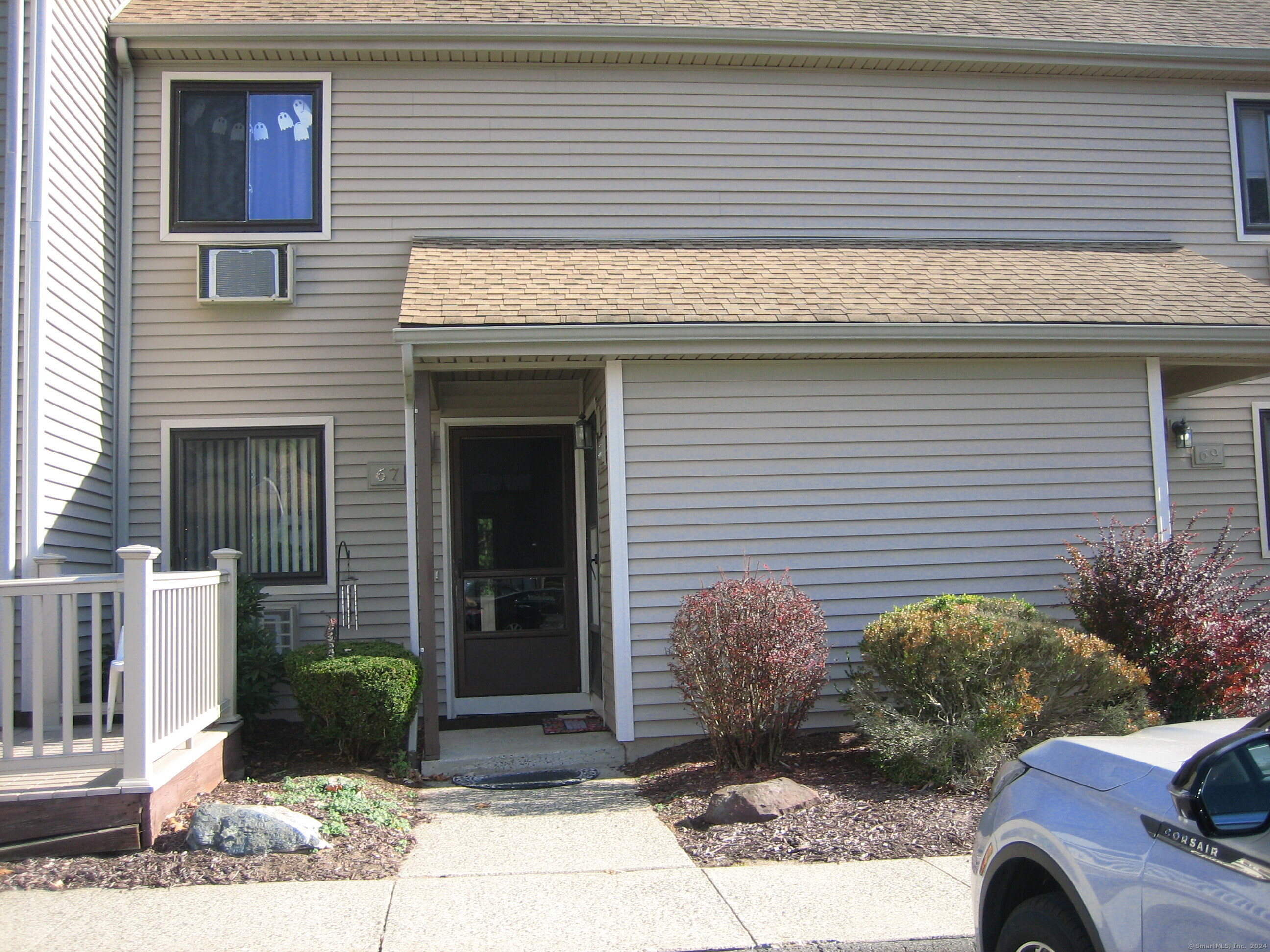 a front view of a house with garden