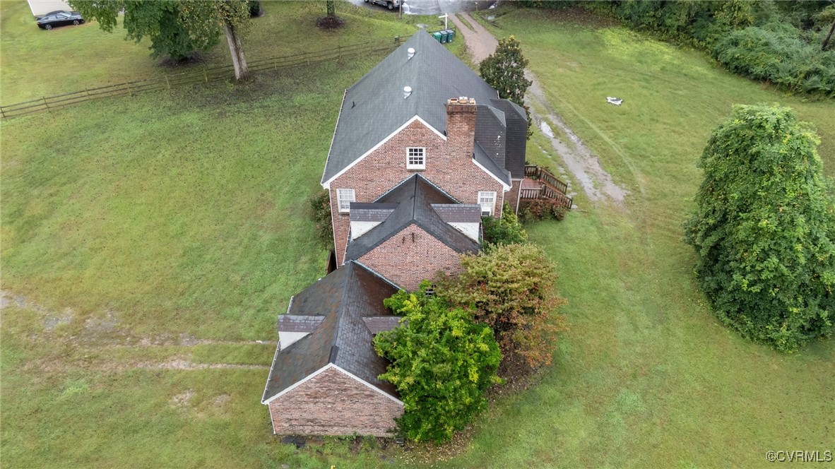 an aerial view of house with yard swimming pool and outdoor seating