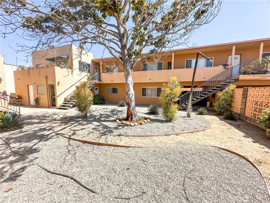 a view of a house with snow on the road