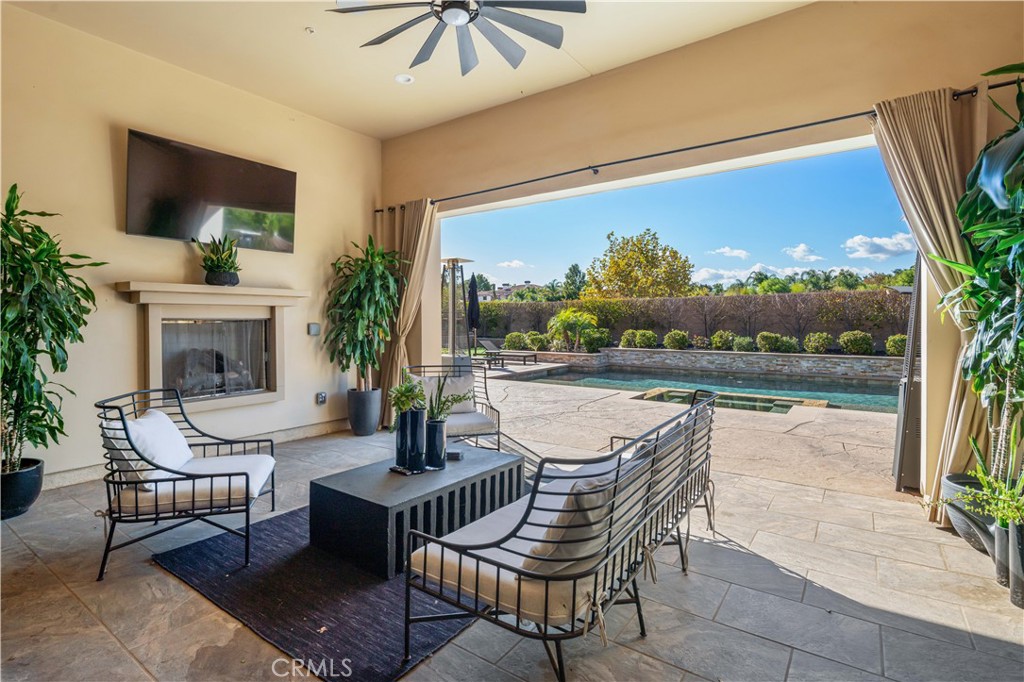 a swimming pool with outdoor seating and yard