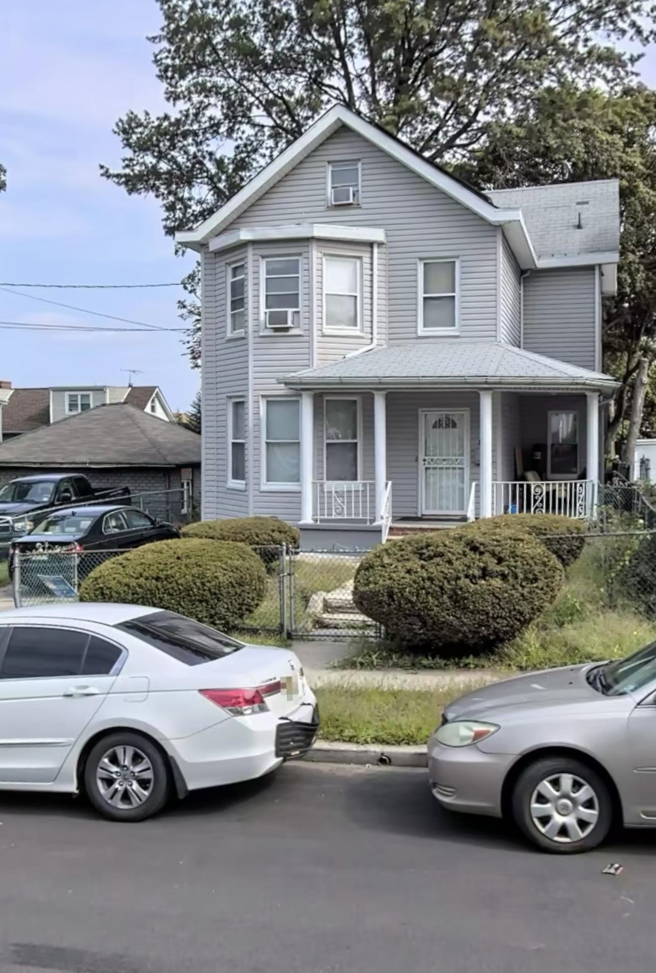 a front view of a house with parking space