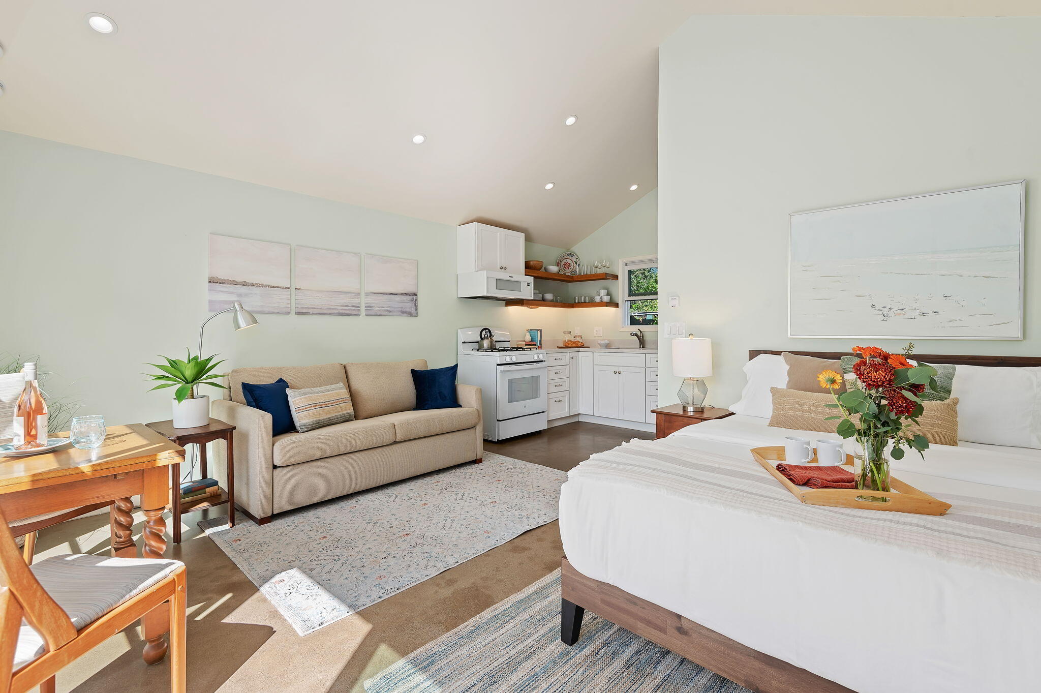 a living room with furniture and white walls