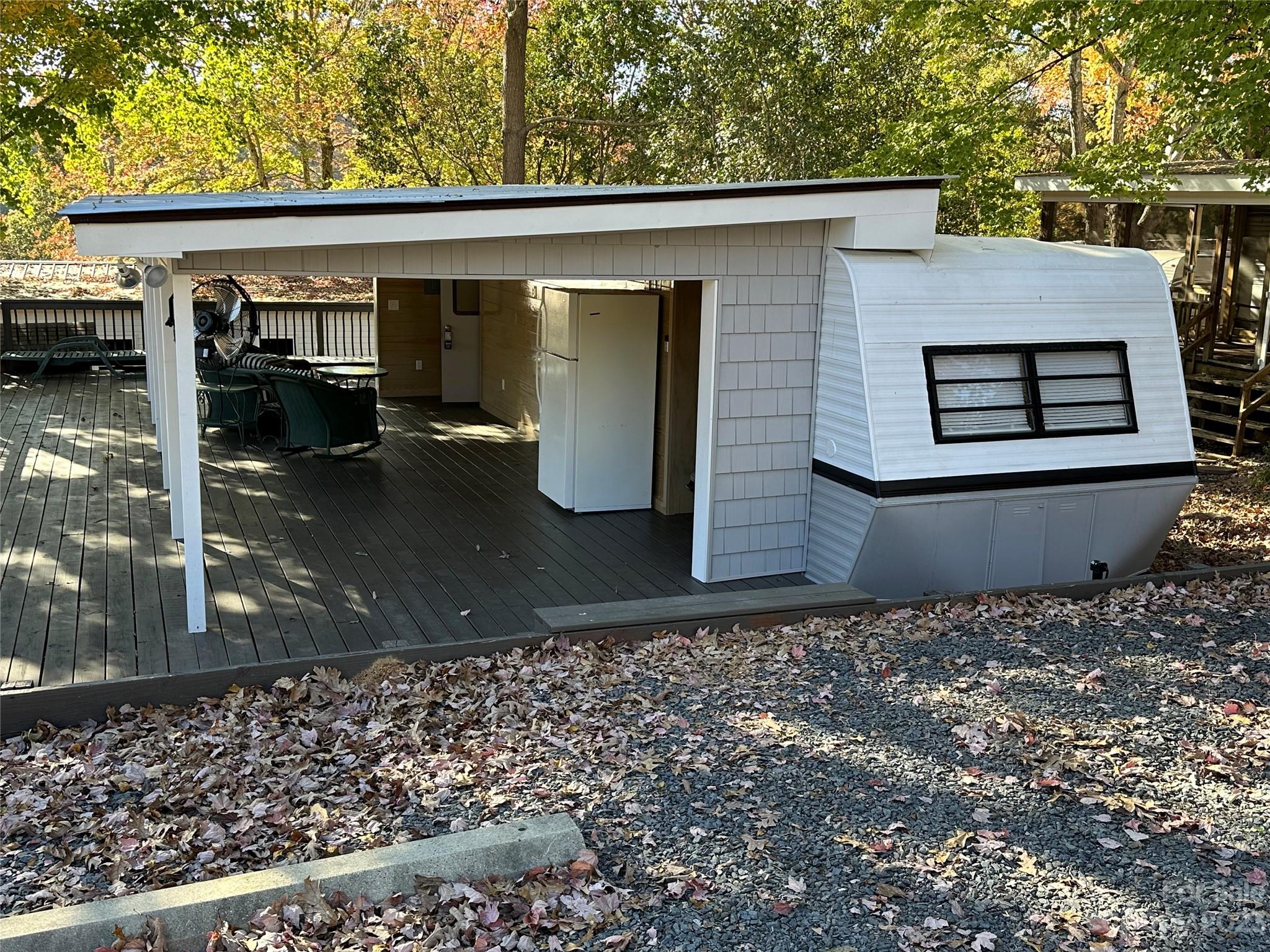 a backyard of a house with barbeque oven