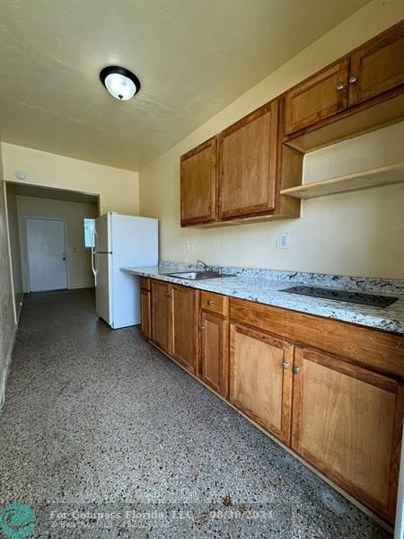 a kitchen with a sink and cabinets