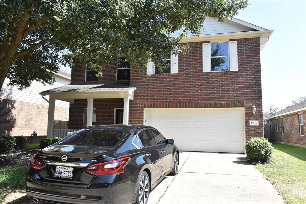 a car parked in front of a house