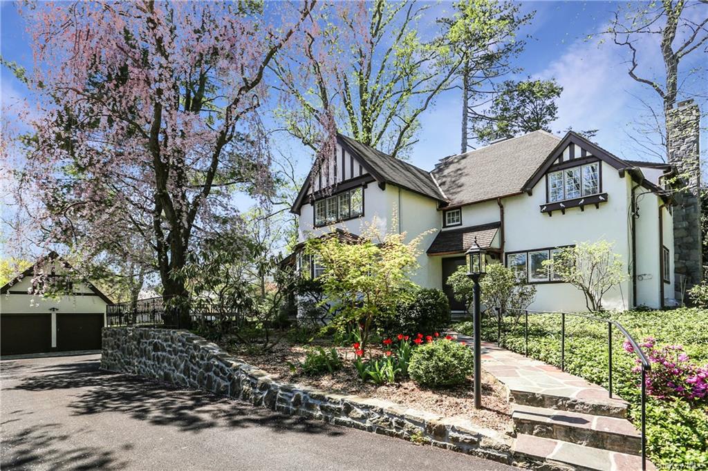 Gorgeous and meticulously maintained Tudor, just a short walk to Scarsdale Village, High School, train, shopping and tennis.