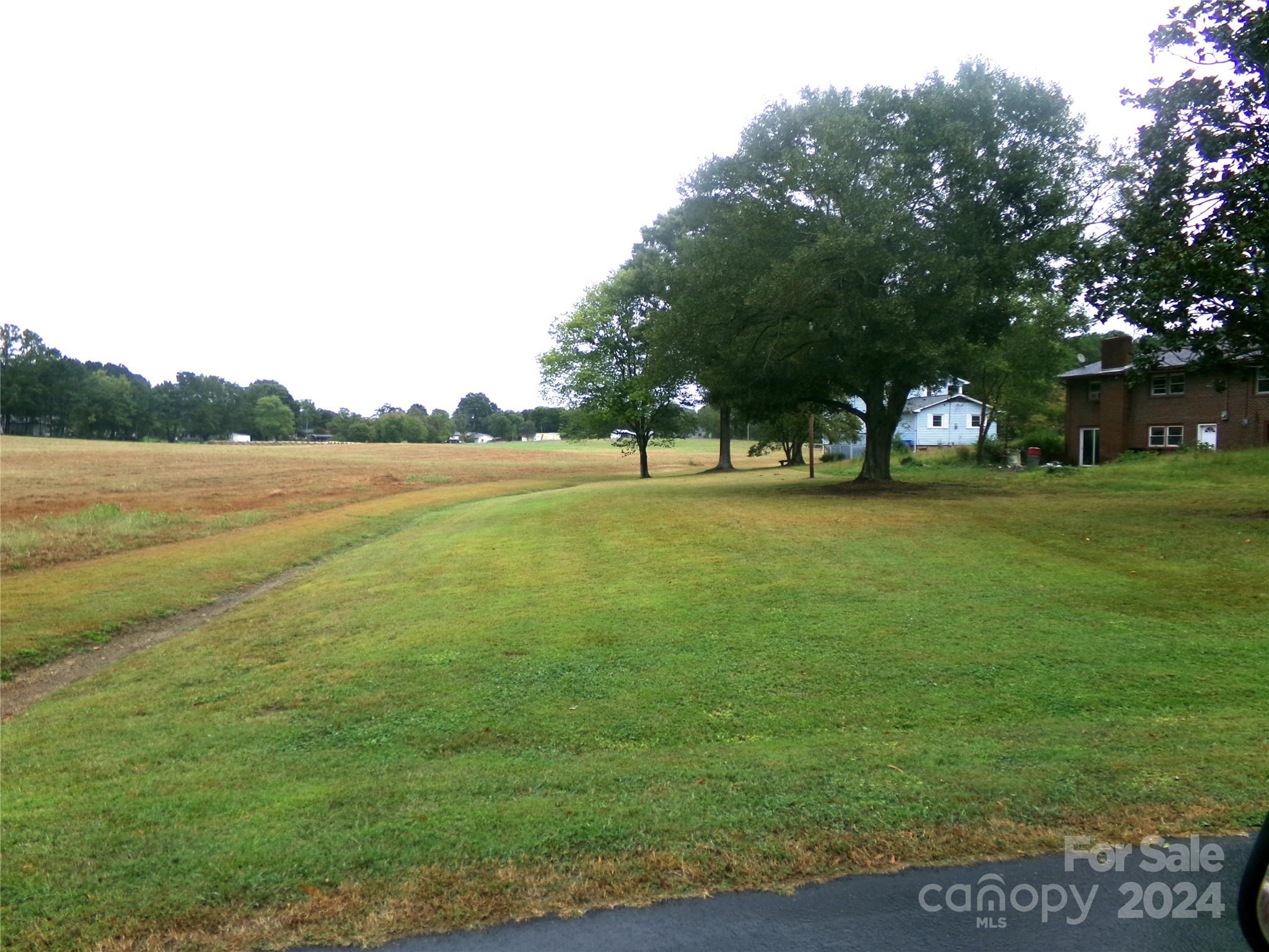 a view of a lake with a big yard