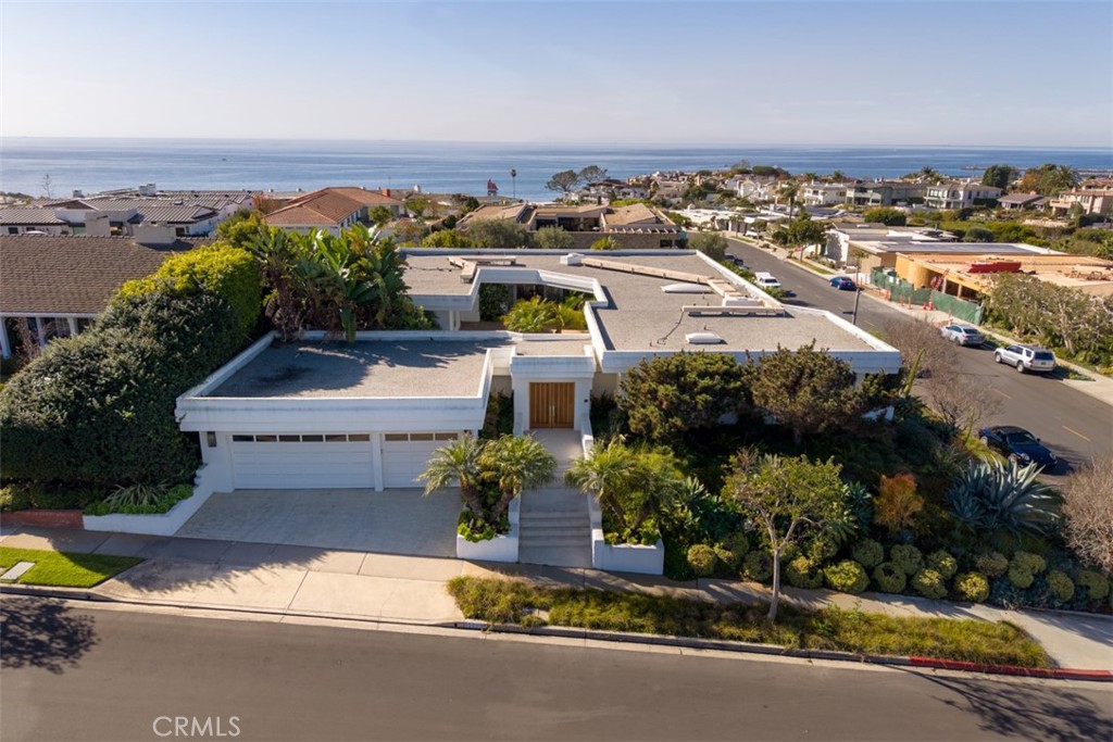 an aerial view of a house with a garden