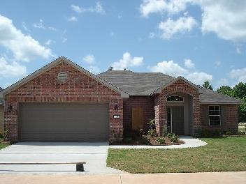 a front view of house with yard