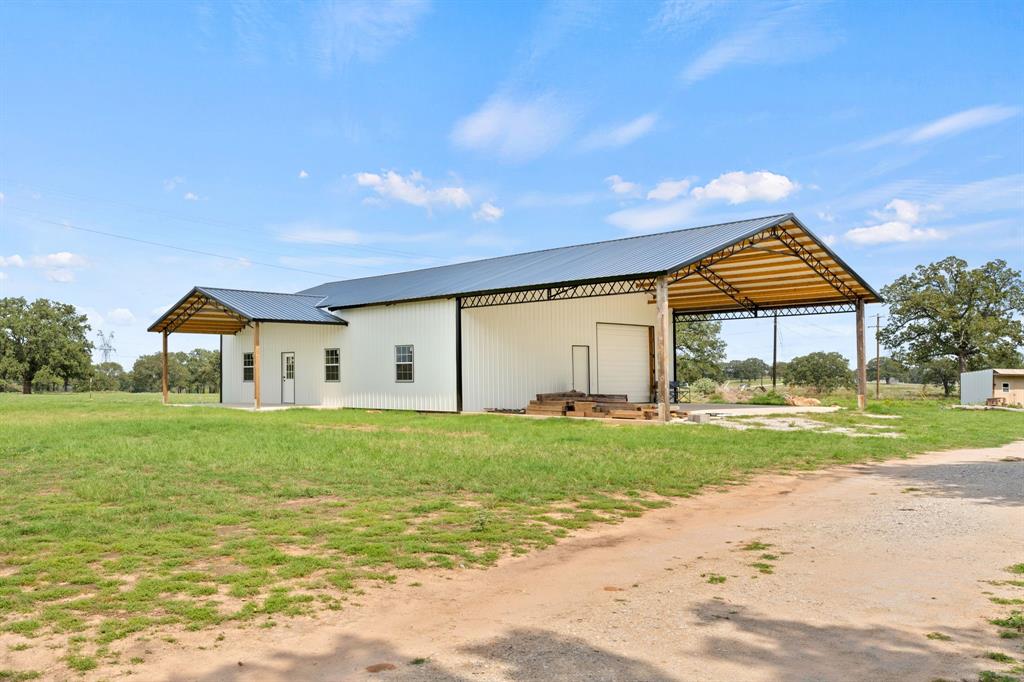 a front view of house with yard and garage