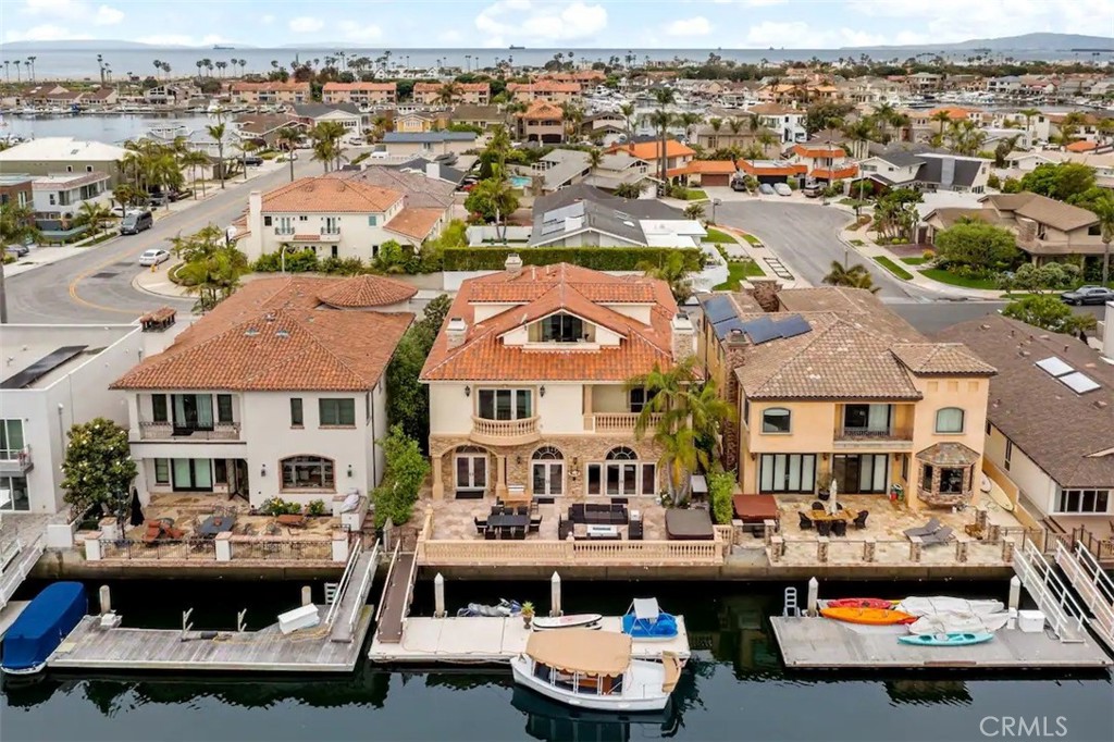 an aerial view of a house with swimming pool and outdoor space