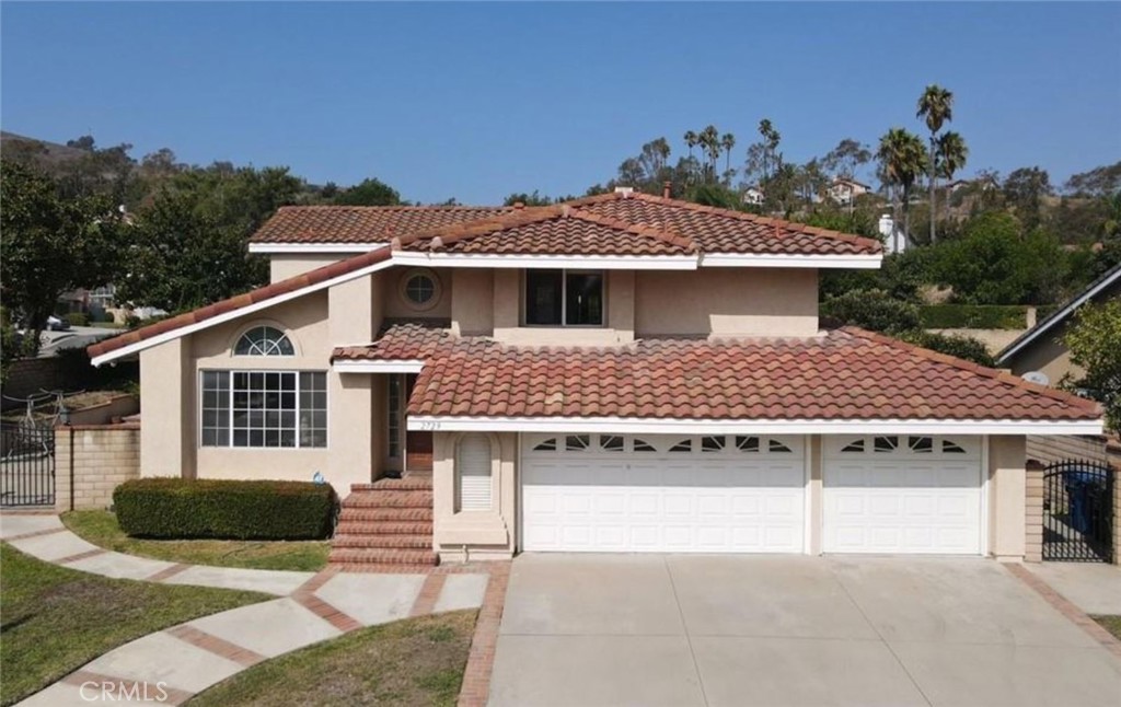 a front view of a house with yard