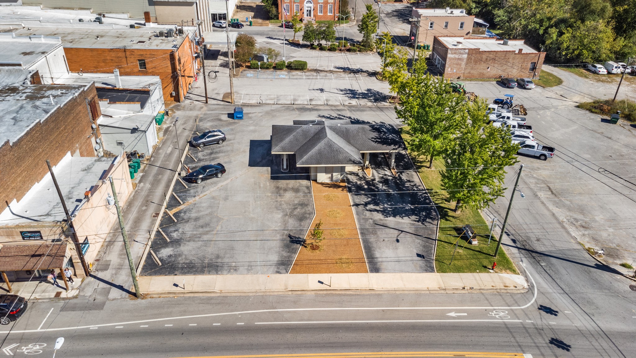 an aerial view of residential houses with outdoor space