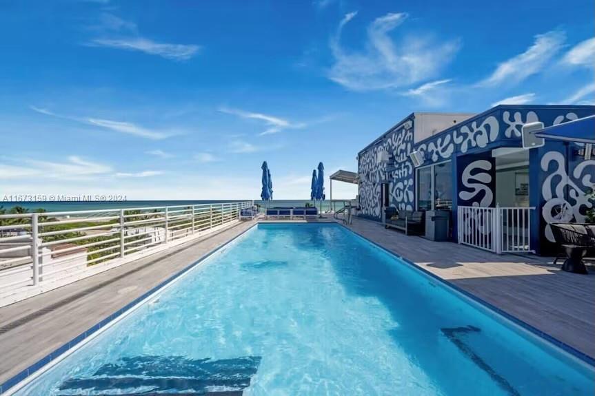 a view of a balcony and ocean view