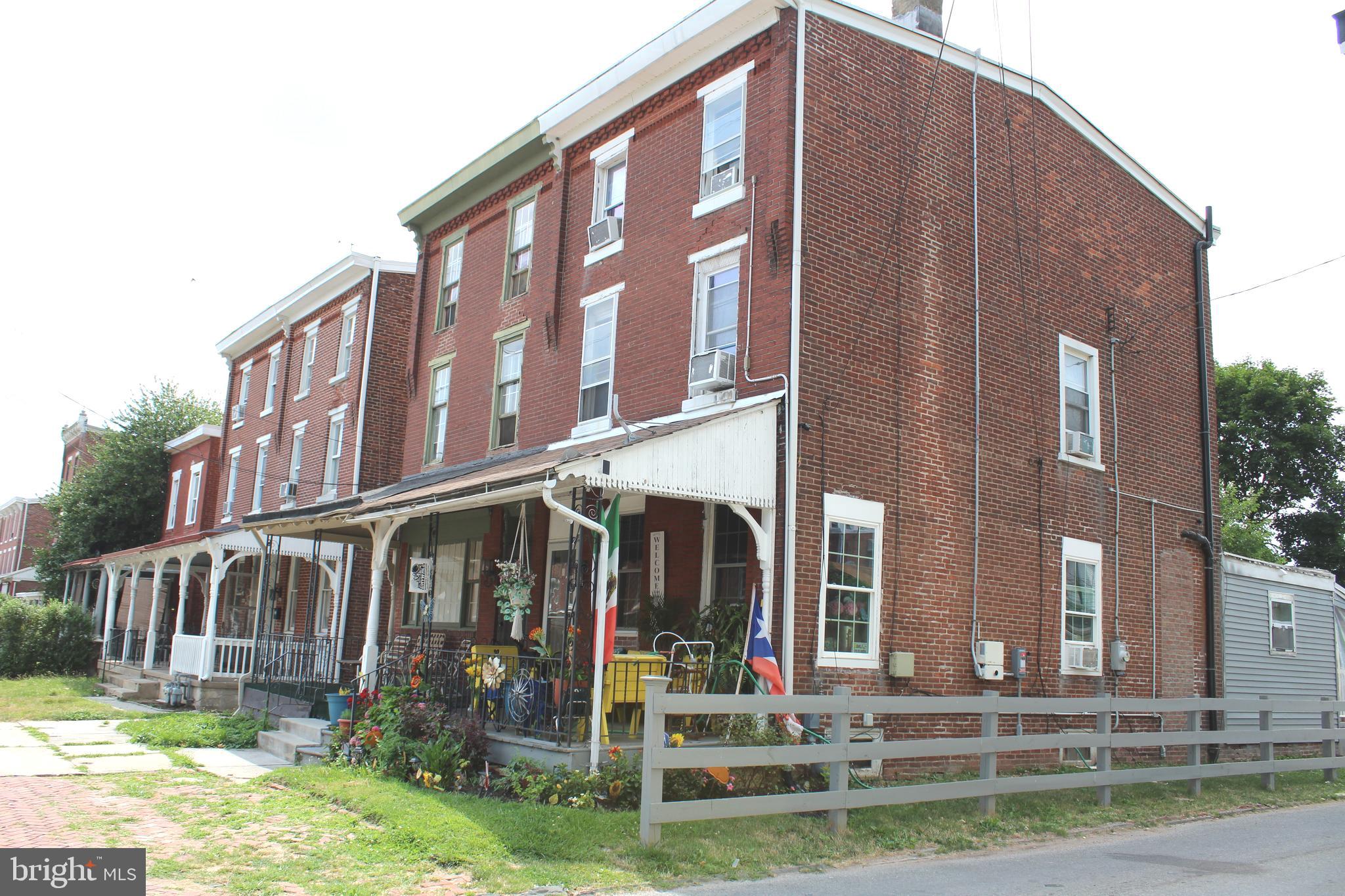 a view of a building with a yard