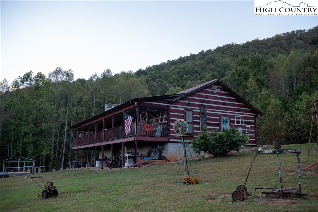 a view of a house with a backyard porch and sitting area