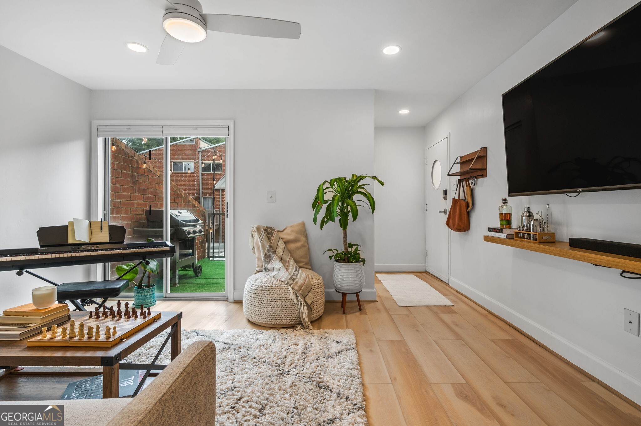 a living room with furniture and a flat screen tv