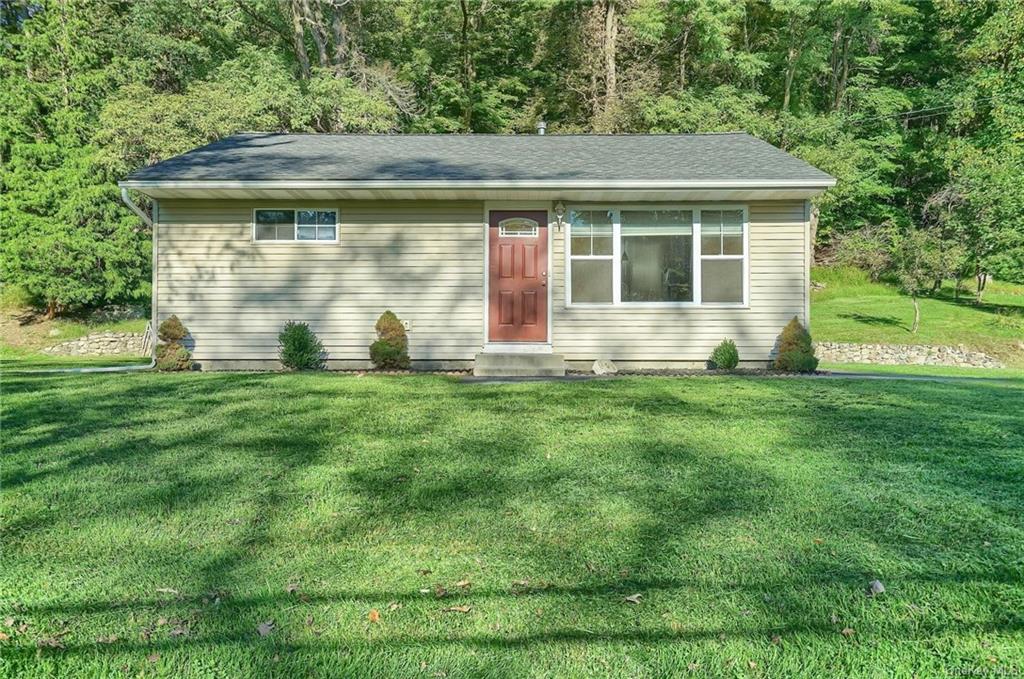 a house with a yard in front of it