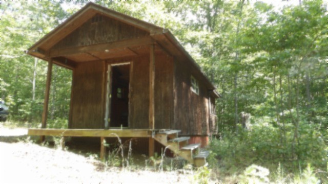 a view of a house with a small yard