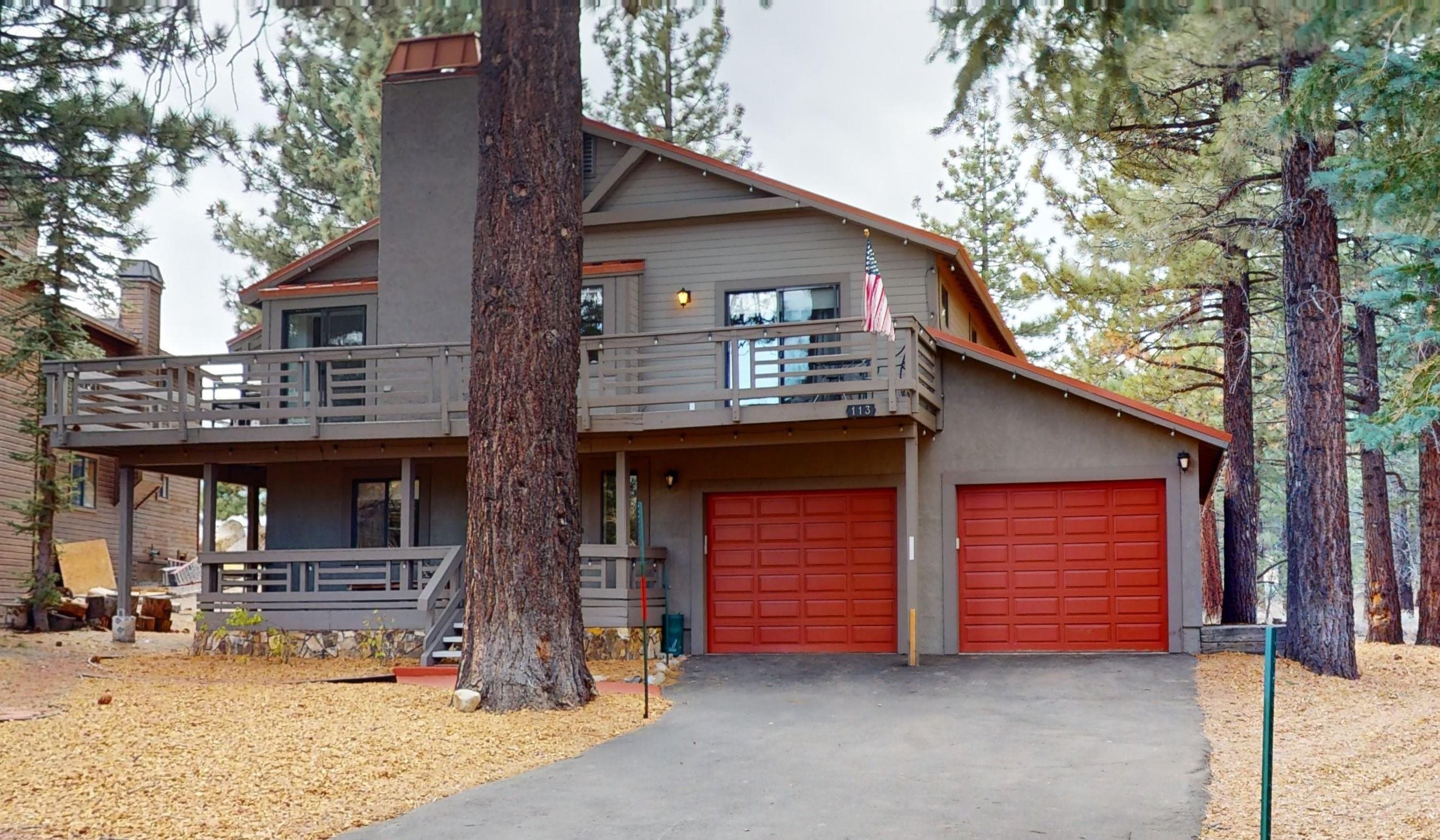 a front view of a house with garage