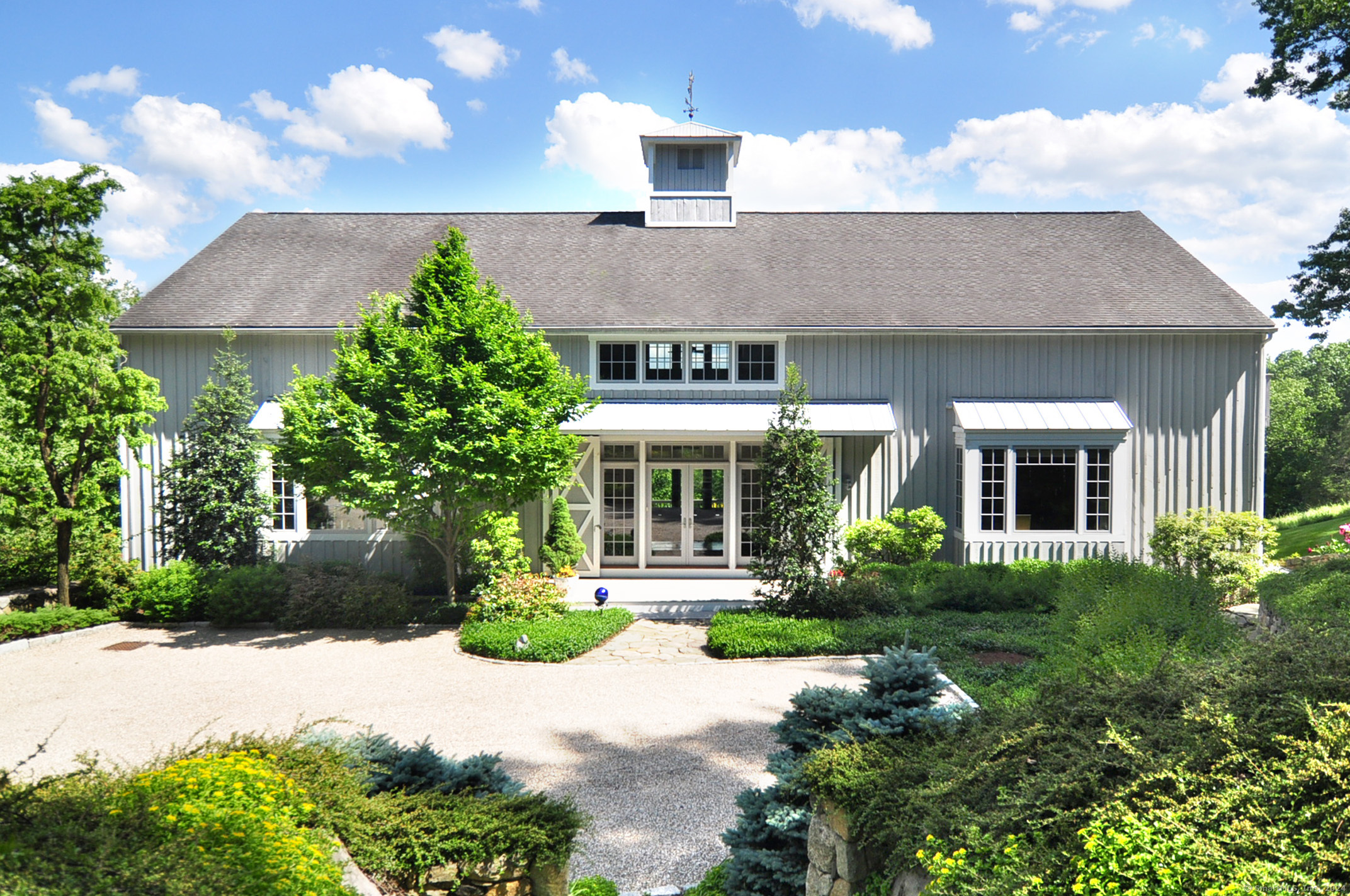 front view of a house with a yard