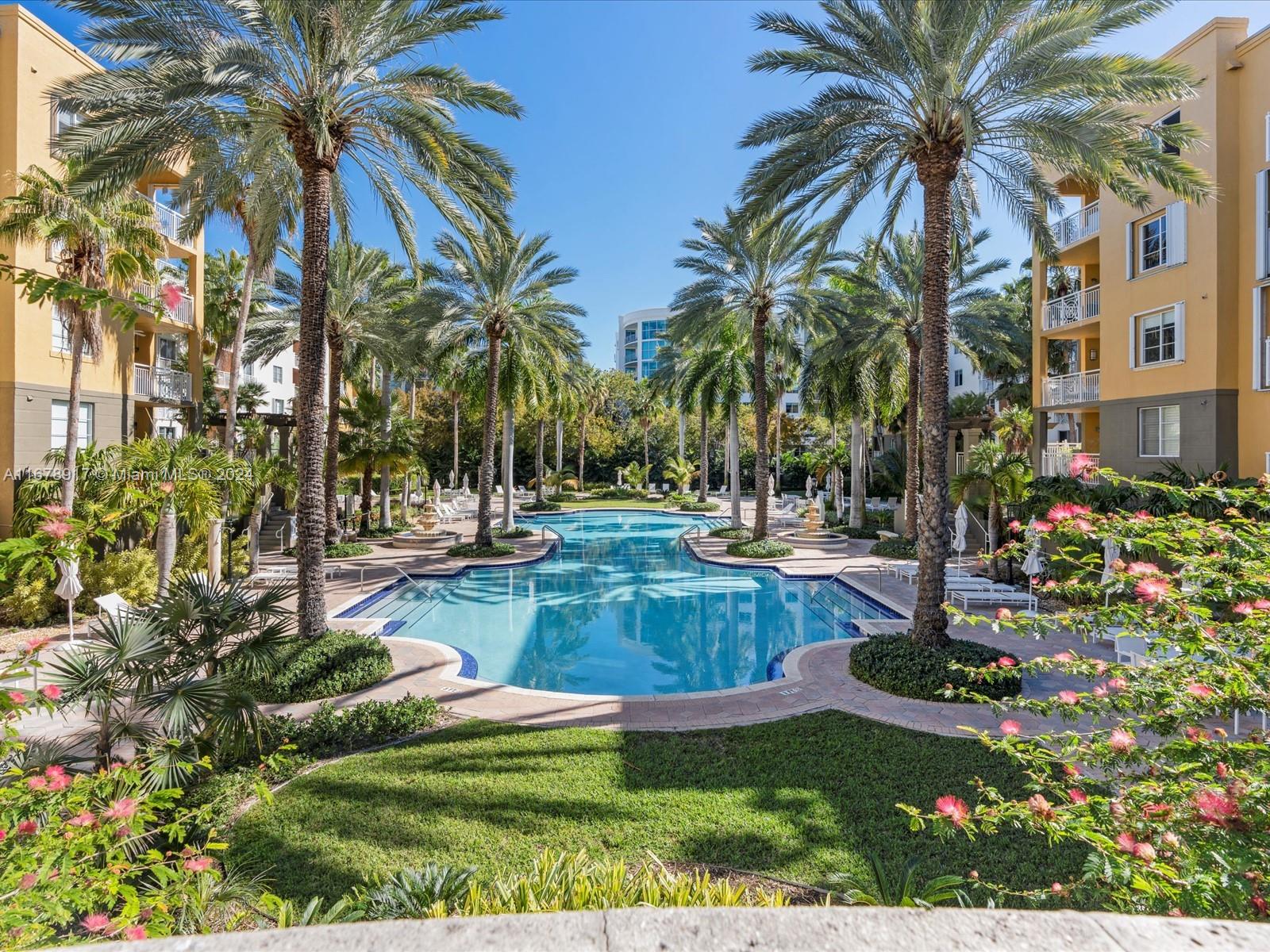 a view of a yard with palm trees