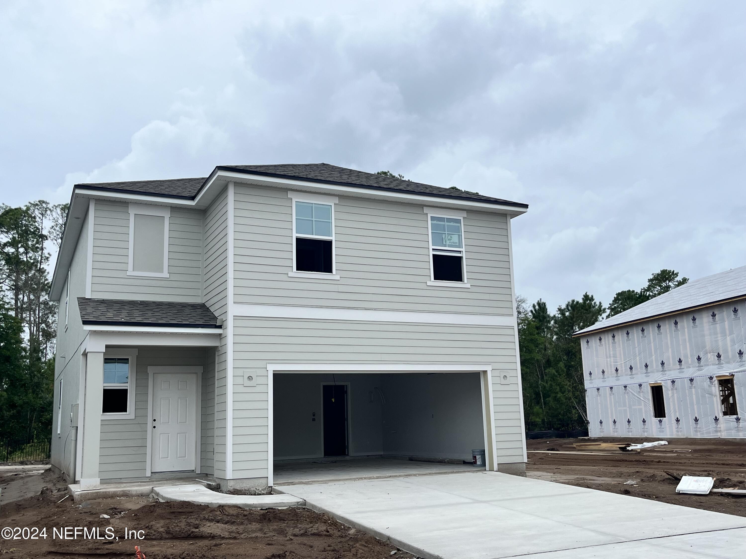 a front view of a house with a garage