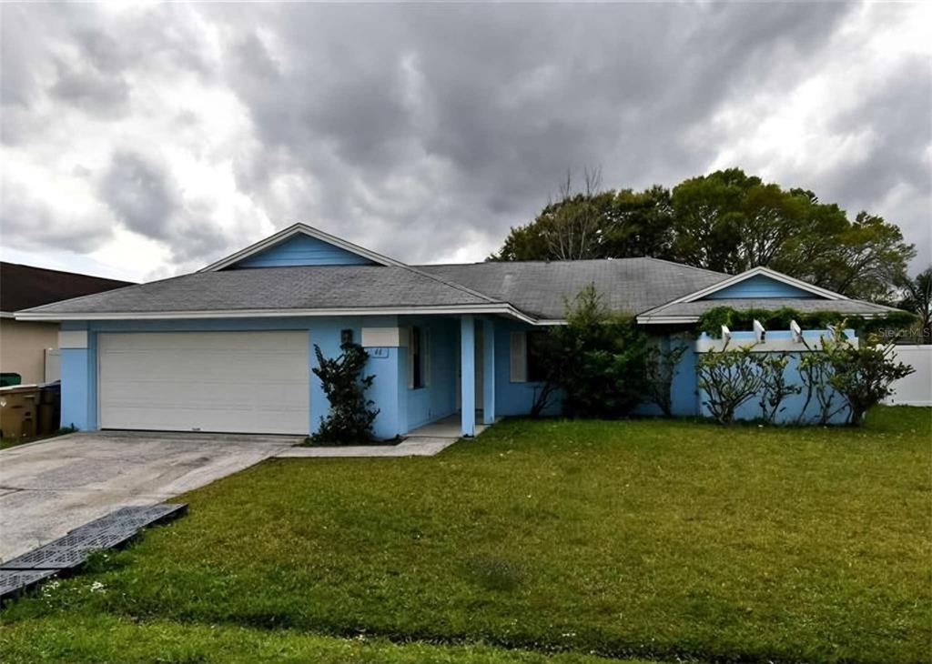 a front view of a house with yard