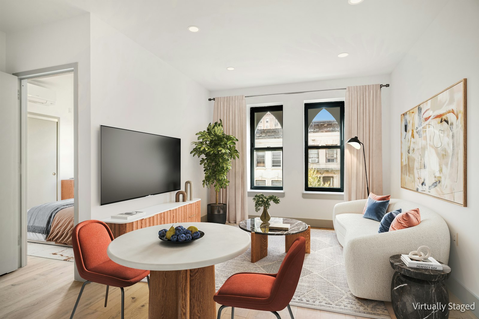 a living room with furniture and a flat screen tv