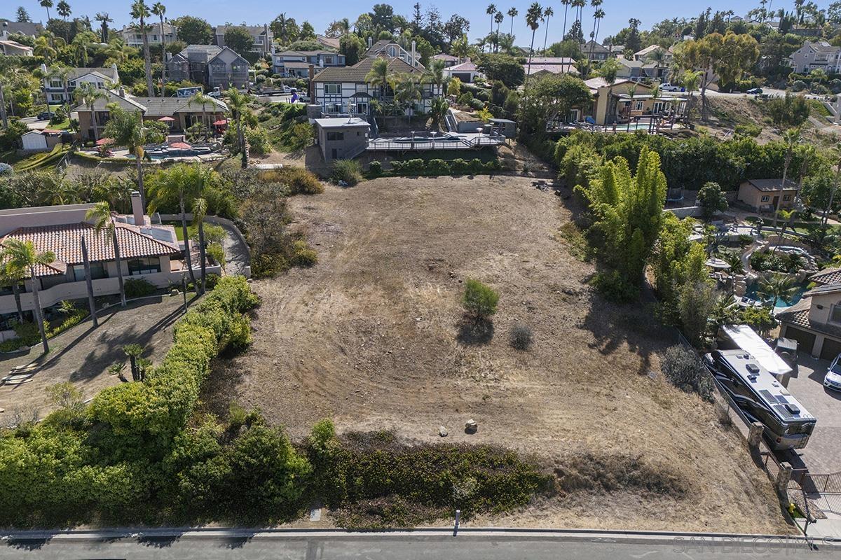 an aerial view of a house with a yard basket ball court and outdoor seating