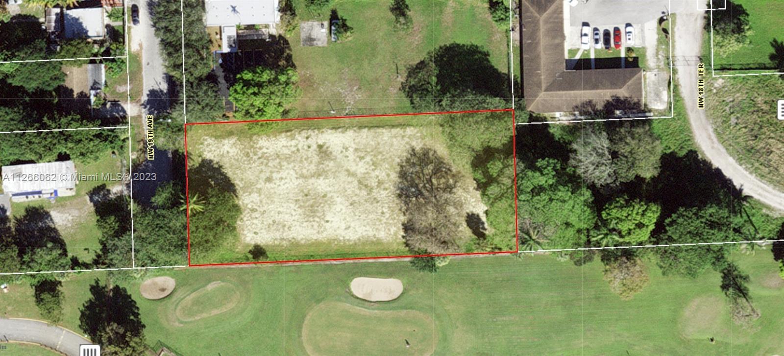 an aerial view of a residential houses with outdoor space