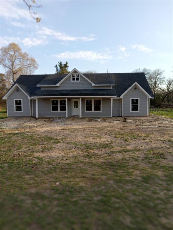 a view of a house next to a big yard