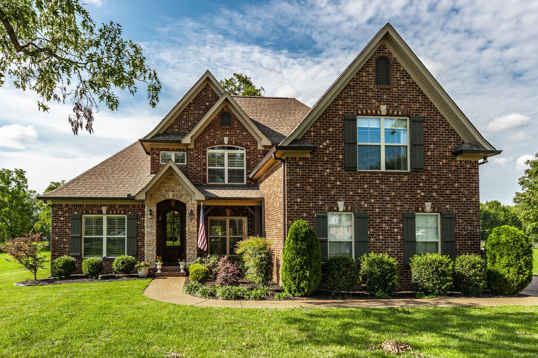 a front view of a house with a yard