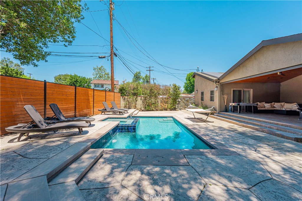 a view of a swimming pool with a lounge chairs