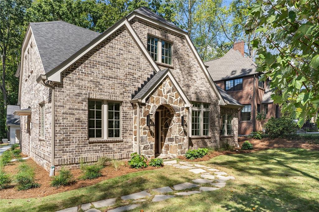 a view of a house with brick walls