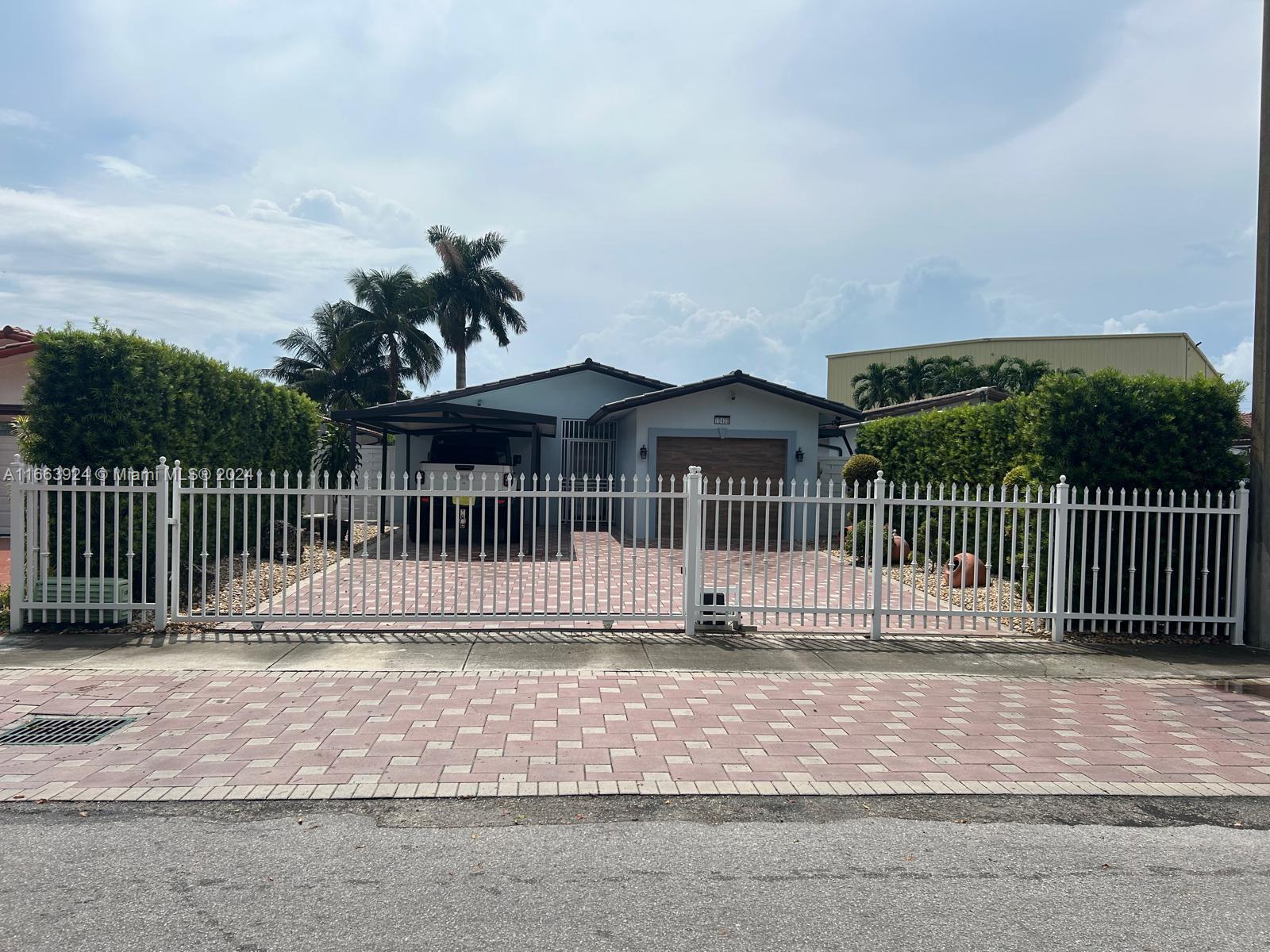 a view of a house with a fence