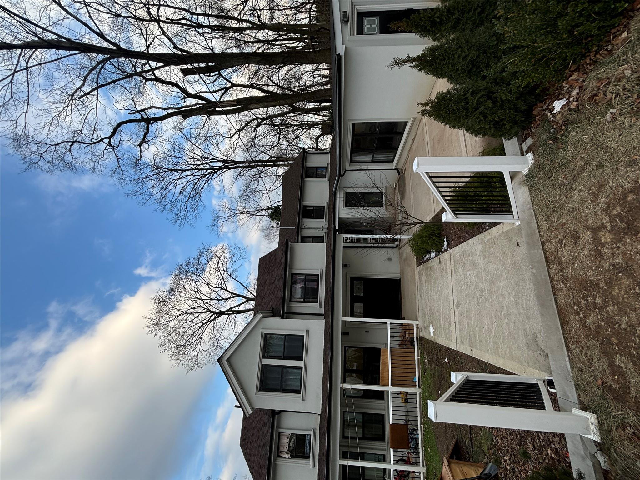 Back of house featuring a porch