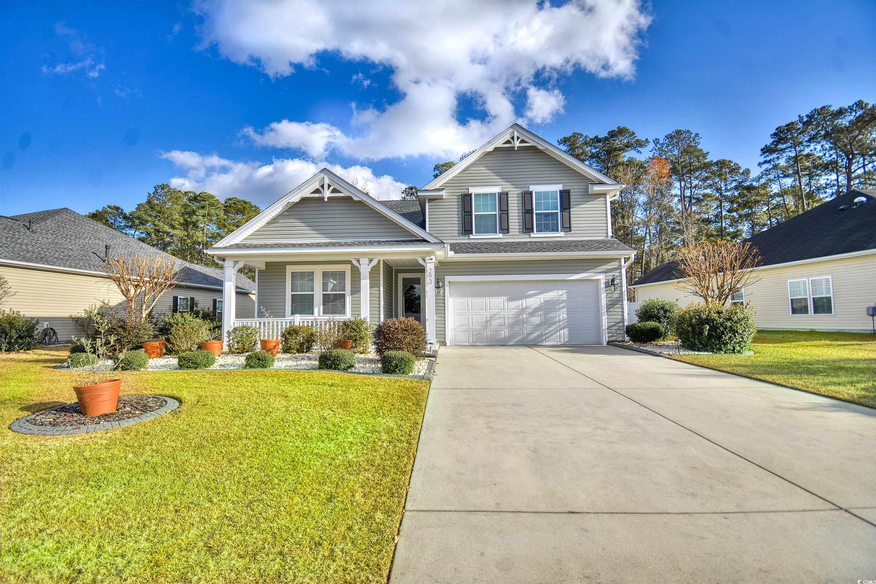 View of front of home with a front lawn, a porch,