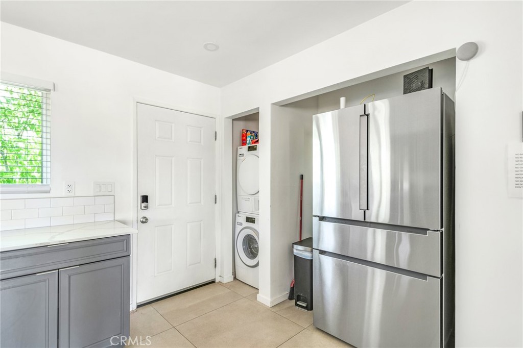 Main entry, including stackable washer, dryer and refrigerator