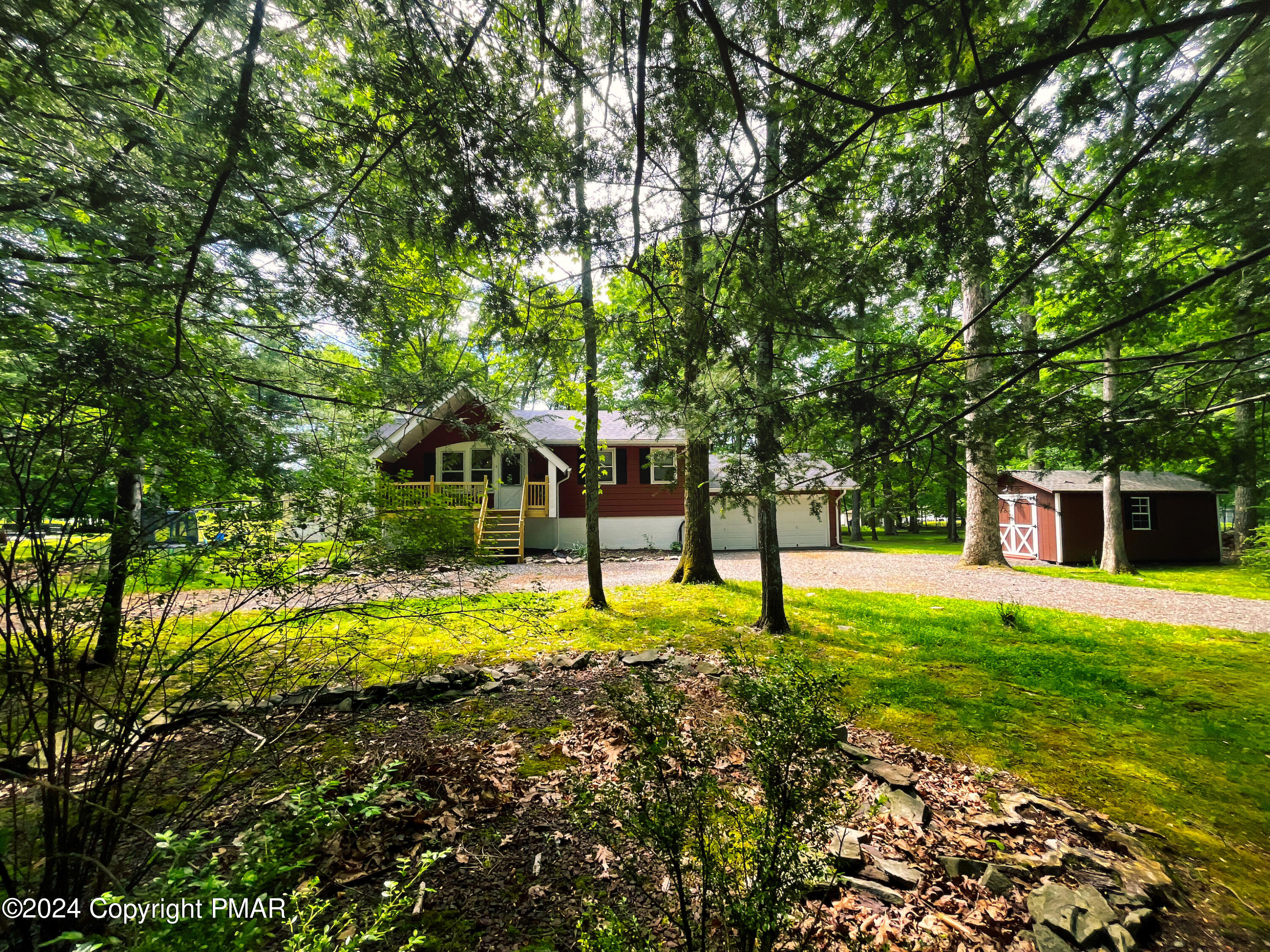 a house with trees in the background