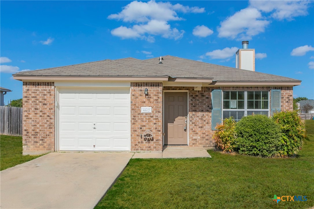 front view of a house with a garden