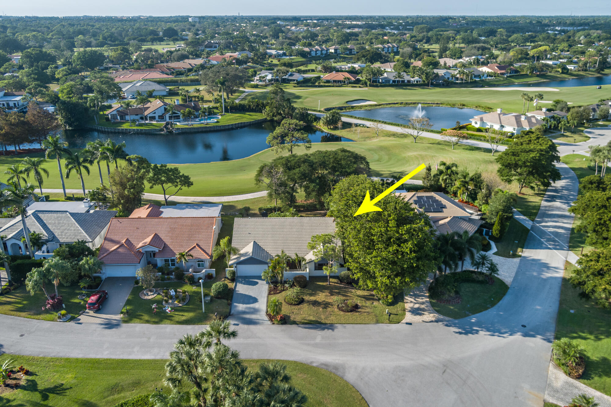 an aerial view of a house with a lake view