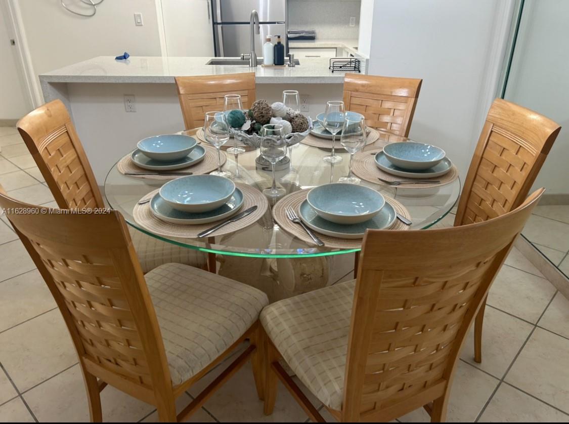 a kitchen with a table and chairs in it