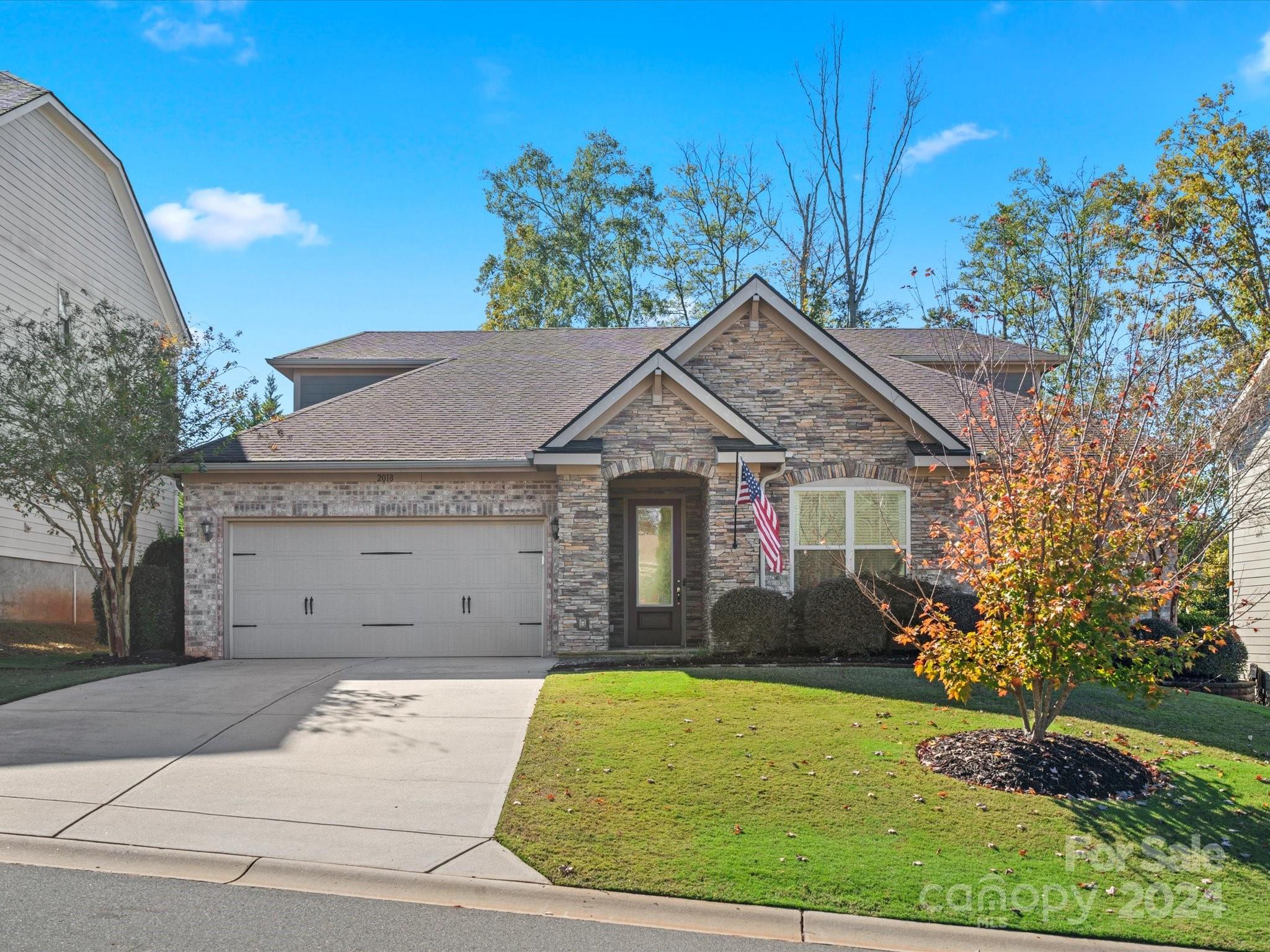 front view of a house with a yard