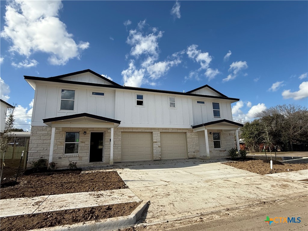 a front view of a house with yard