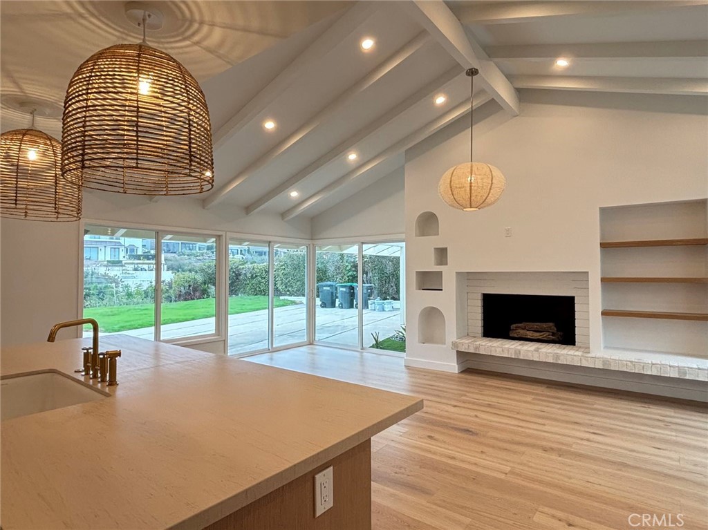 a room with pool table and windows