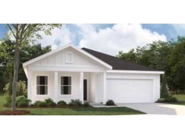 View of front facade featuring a garage