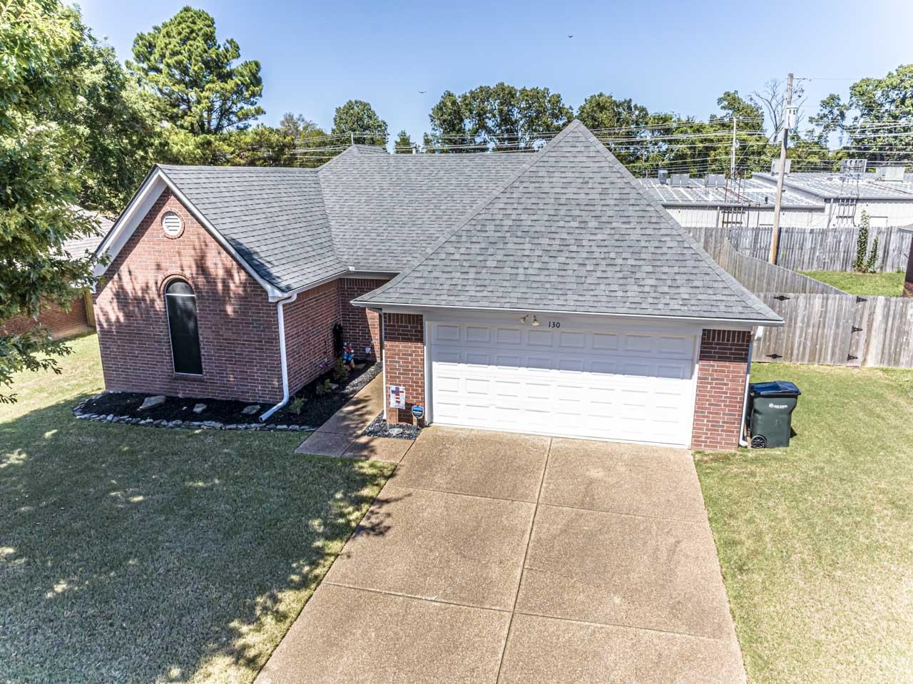 View of front of house featuring a garage and a front yard