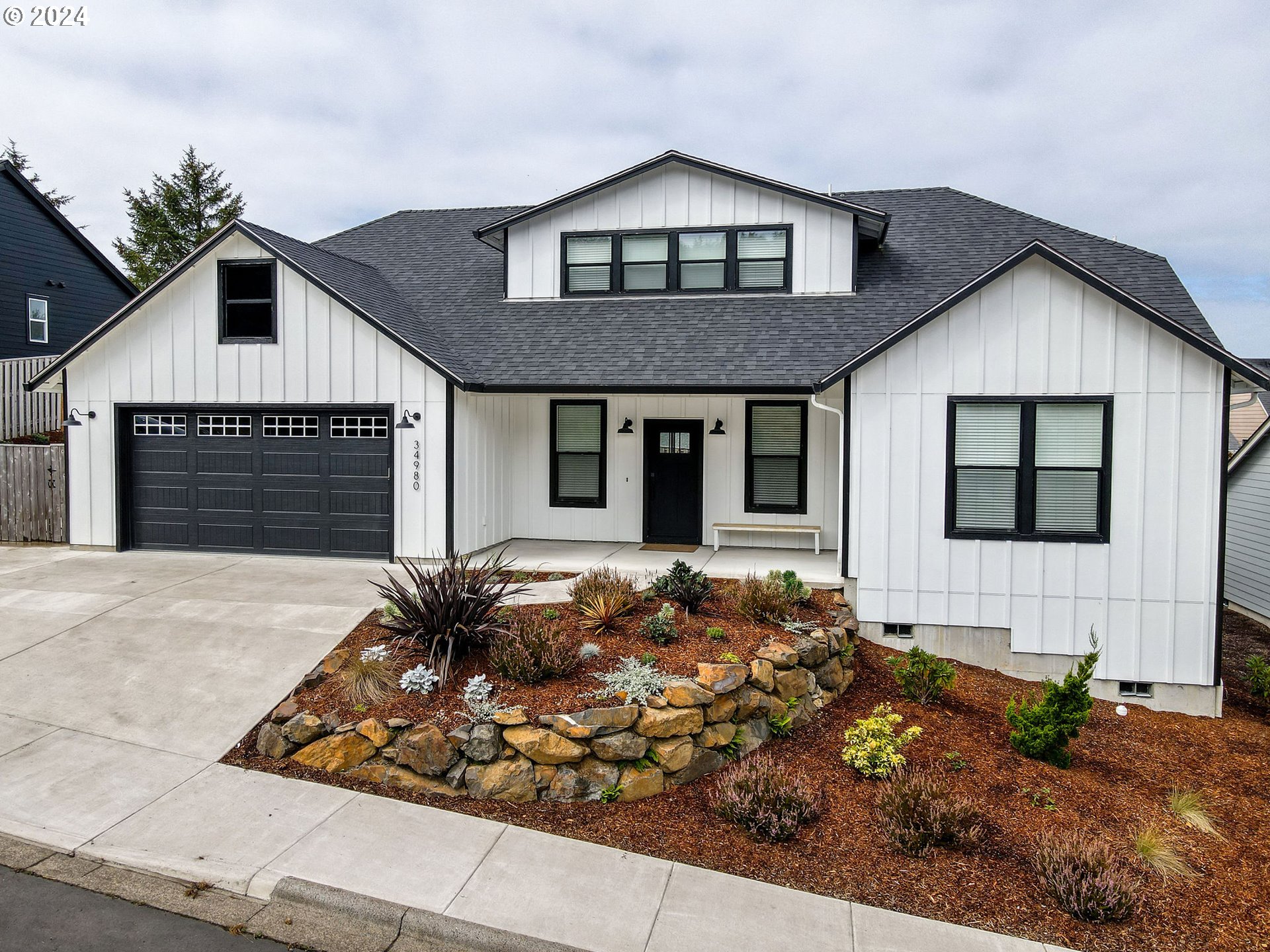 a front view of a house with garden